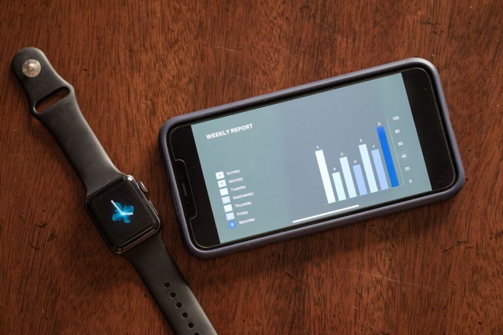 Smartwatch and smartphone showing a weekly sleep tracking report